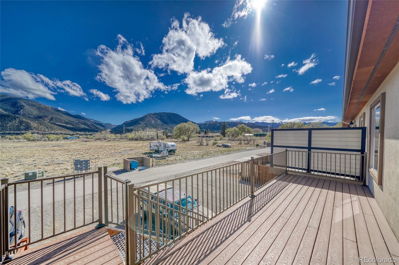 209 Summitview Lane Poncha Springs, CO 81201 - Photo 20 of 44 a view of a balcony with wooden floor