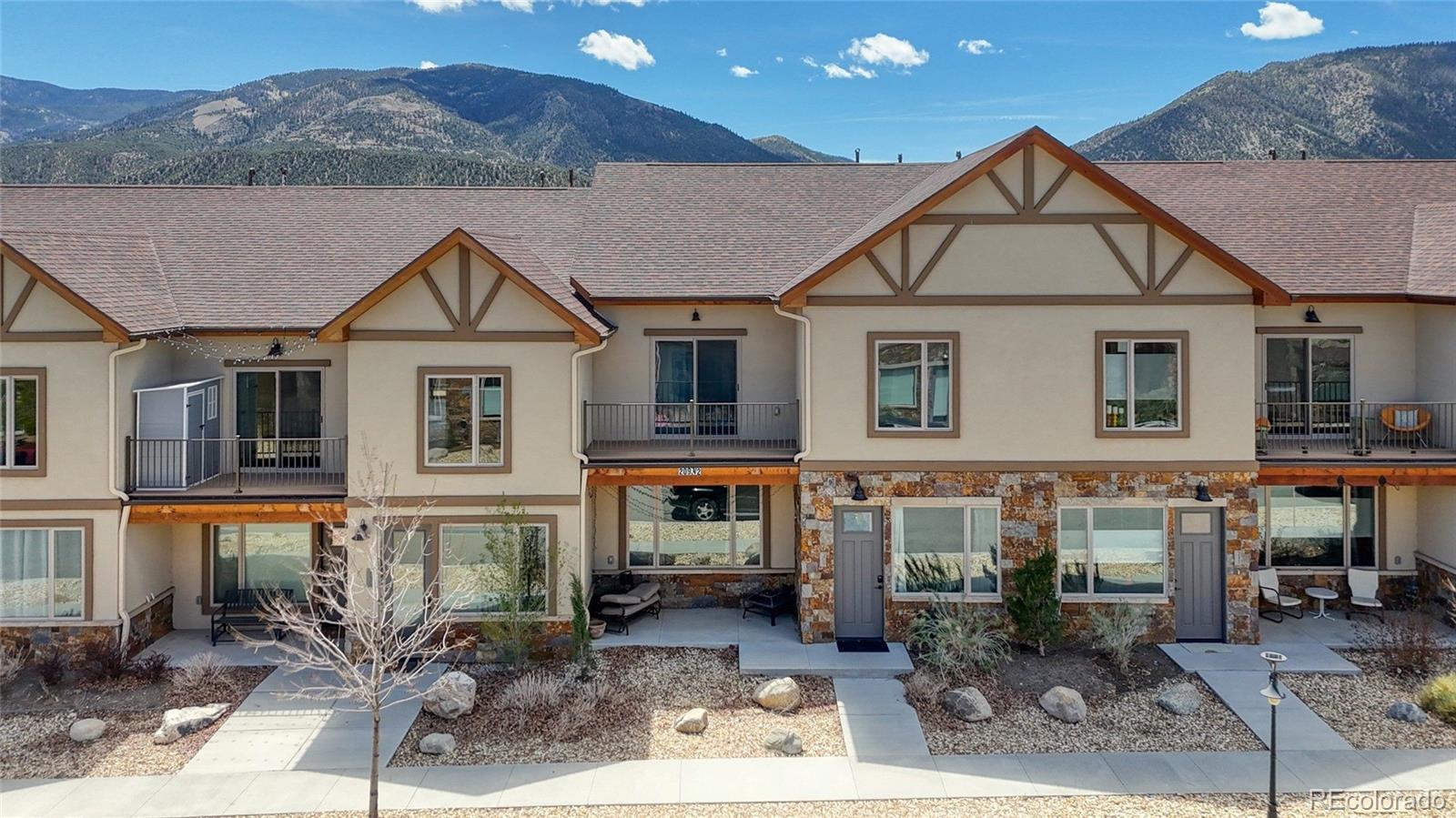 209 Summitview Lane Poncha Springs, CO 81201 - Photo 2 of 44 a front view of a house with garden