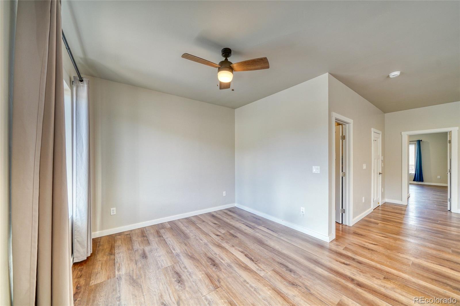 209 Summitview Lane Poncha Springs, CO 81201 - Photo 22 of 44 a view of empty room with wooden floor