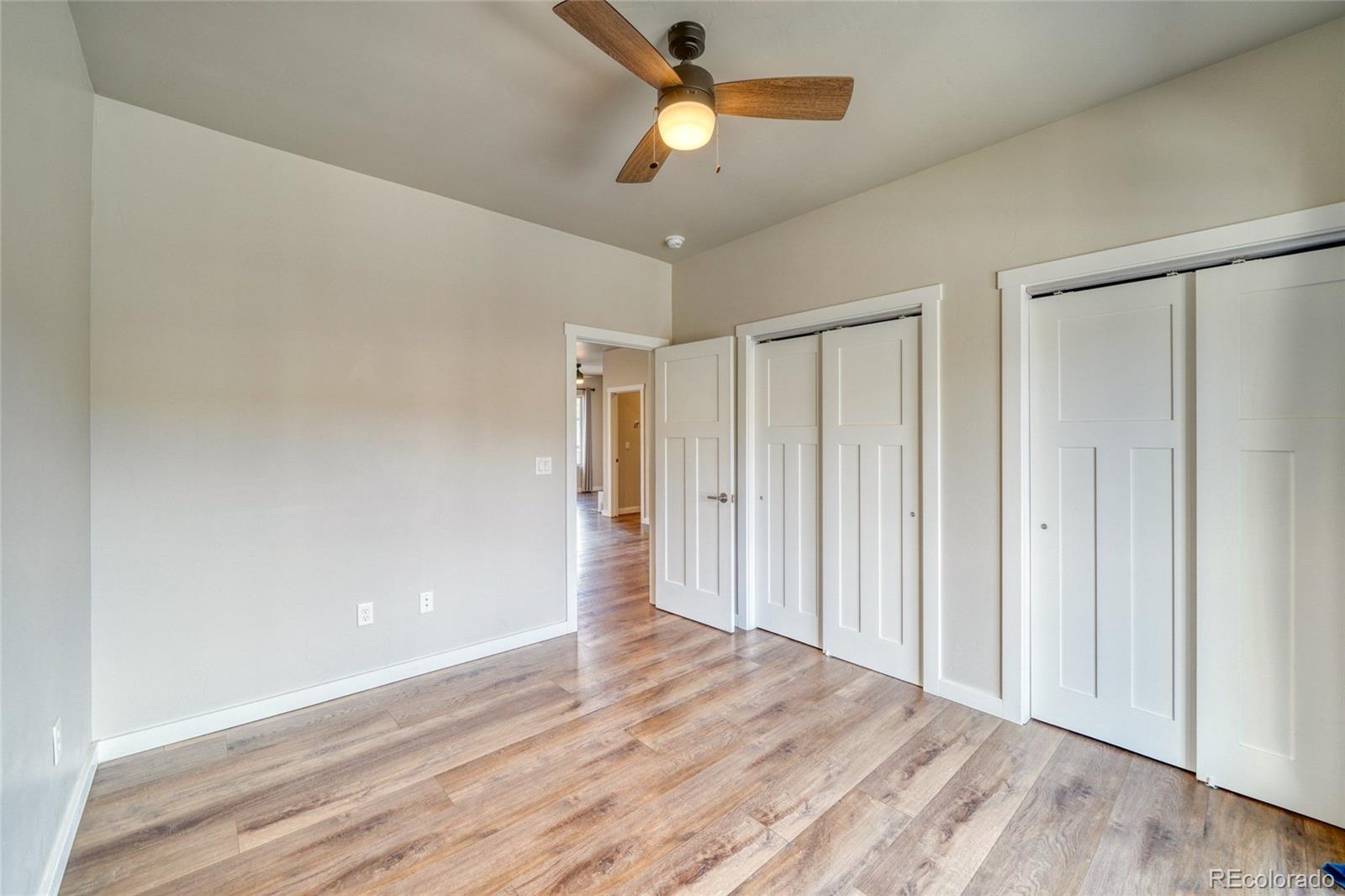 209 Summitview Lane Poncha Springs, CO 81201 - Photo 32 of 44 a view of empty room with wooden floor and ceiling fan