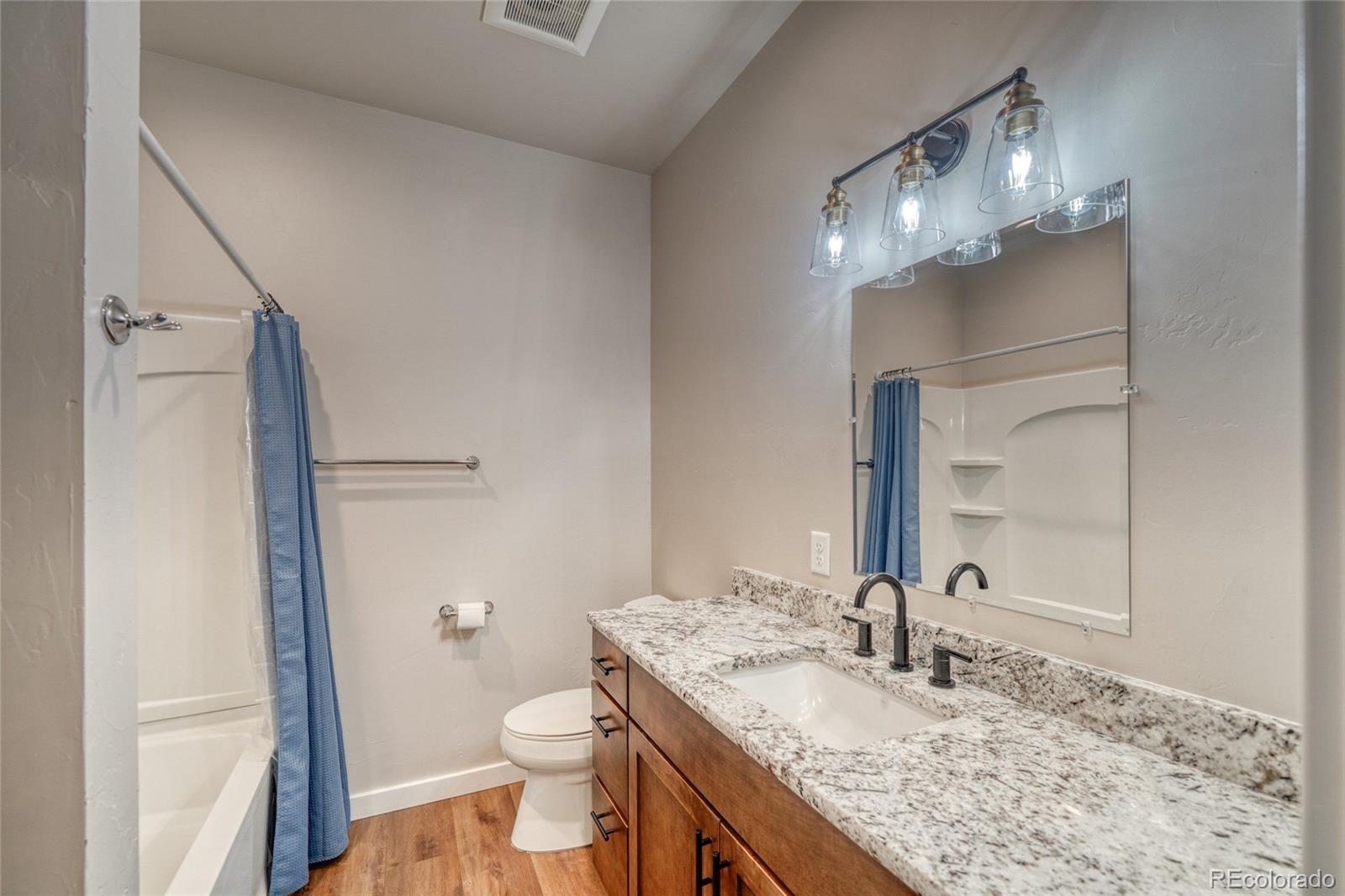 209 Summitview Lane Poncha Springs, CO 81201 - Photo 33 of 44 a bathroom with a granite countertop sink toilet and shower