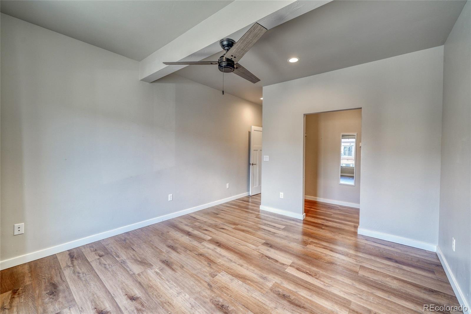 209 Summitview Lane Poncha Springs, CO 81201 - Photo 36 of 44 wooden floor in an empty room with a window