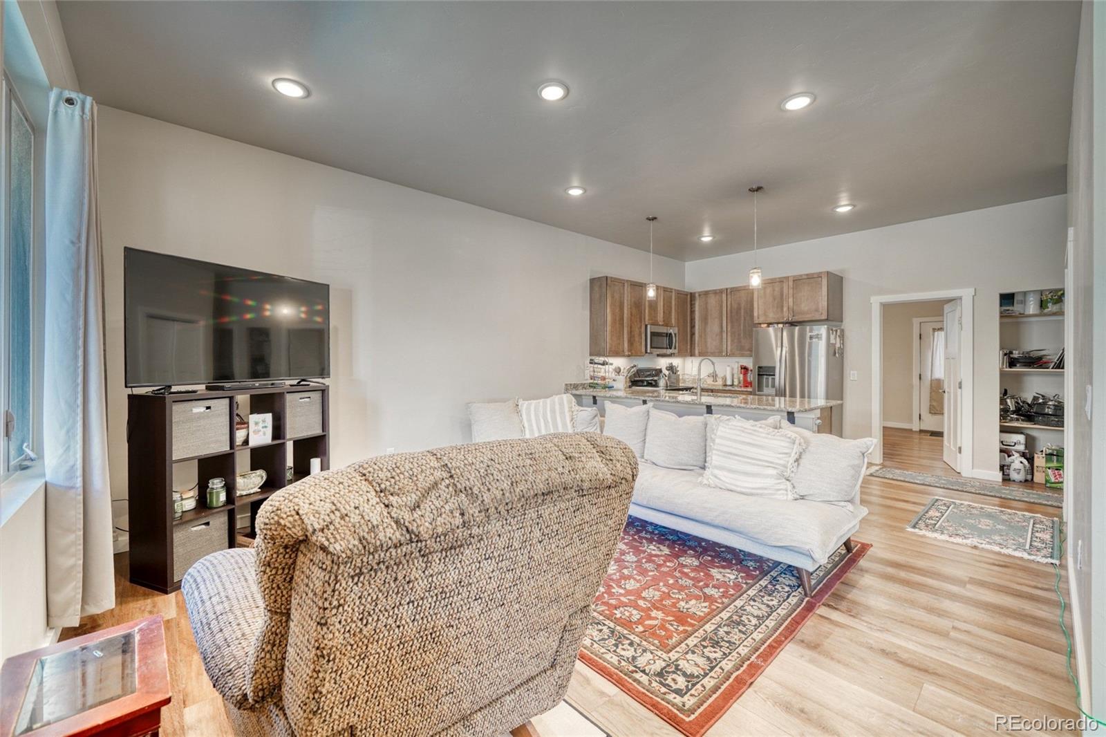 209 Summitview Lane Poncha Springs, CO 81201 - Photo 9 of 44 a living room with furniture and a flat screen tv