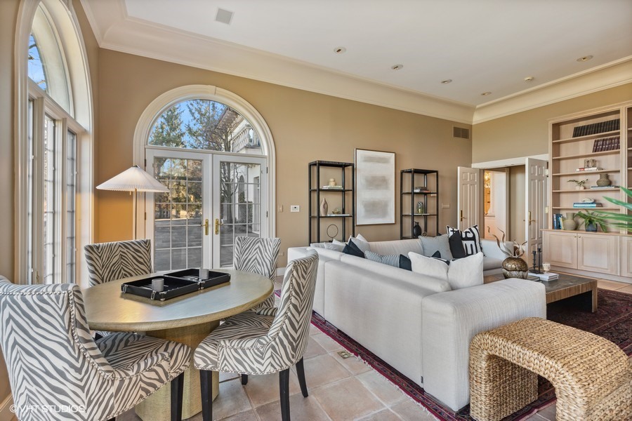 700 Crab Tree Lane Lake Bluff, IL 60044 - Photo 19 of 51 a living room with furniture a clock and a large window