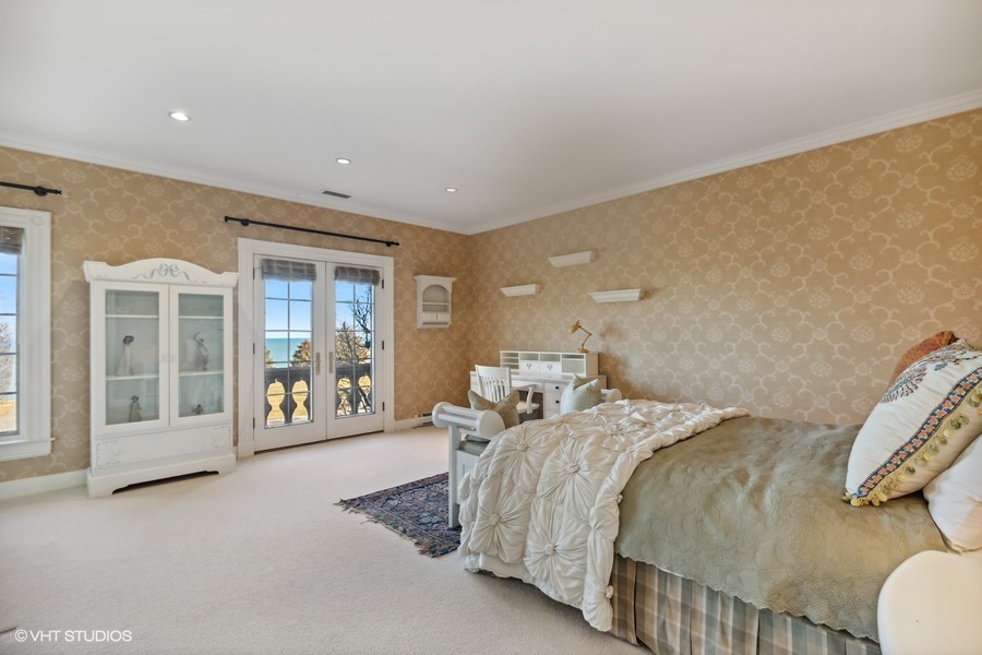 700 Crab Tree Lane Lake Bluff, IL 60044 - Photo 30 of 51 a bedroom with a large bed and a couch