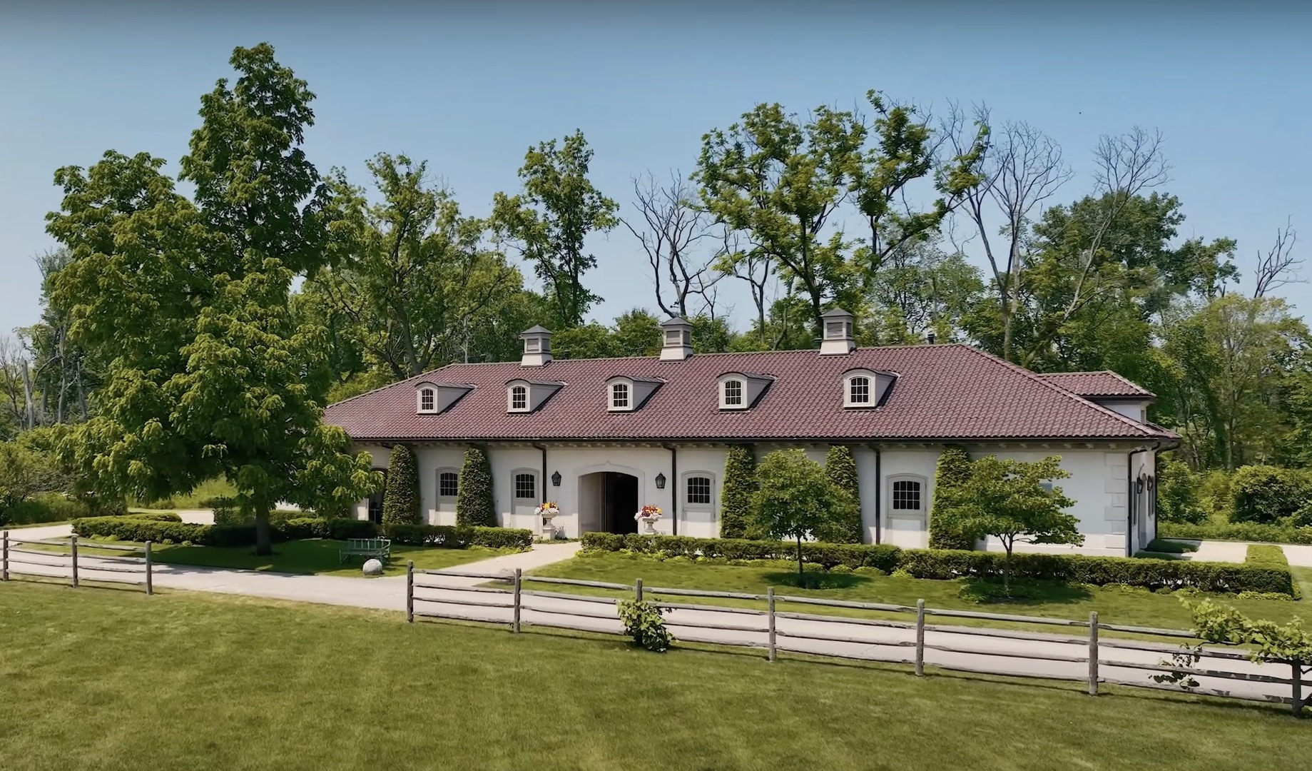 700 Crab Tree Lane Lake Bluff, IL 60044 - Photo 43 of 51 a front view of a house with a yard table and chairs