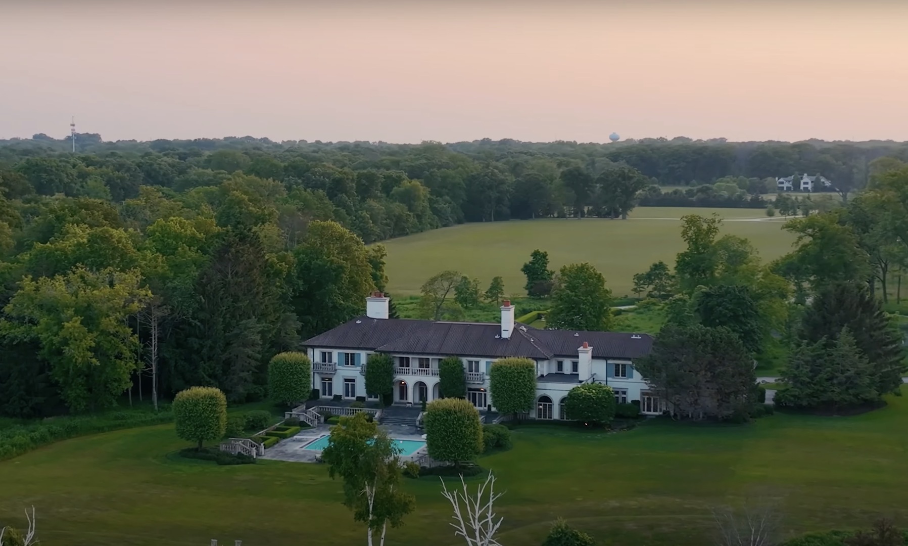 700 Crab Tree Lane Lake Bluff, IL 60044 - Photo 48 of 51 a view of a house with a yard and a fountain