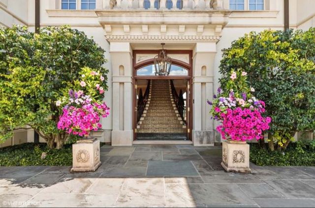 a front view of a building with flowers