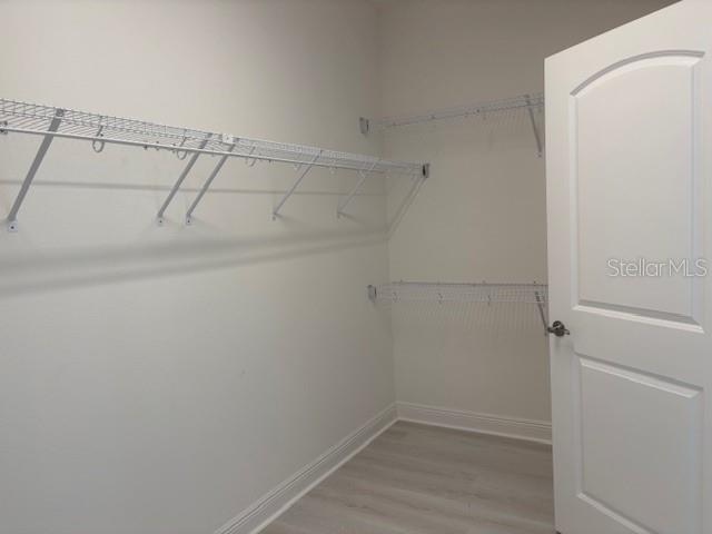 7408 Wing Span Way Harmony, FL 34773 - Photo 14 of 30 a view of storage and utility room with empty racks