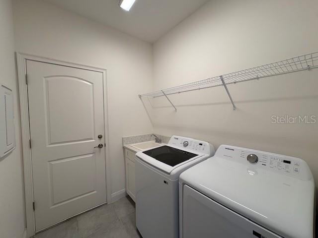 7408 Wing Span Way Harmony, FL 34773 - Photo 19 of 30 a utility room with dryer and washer