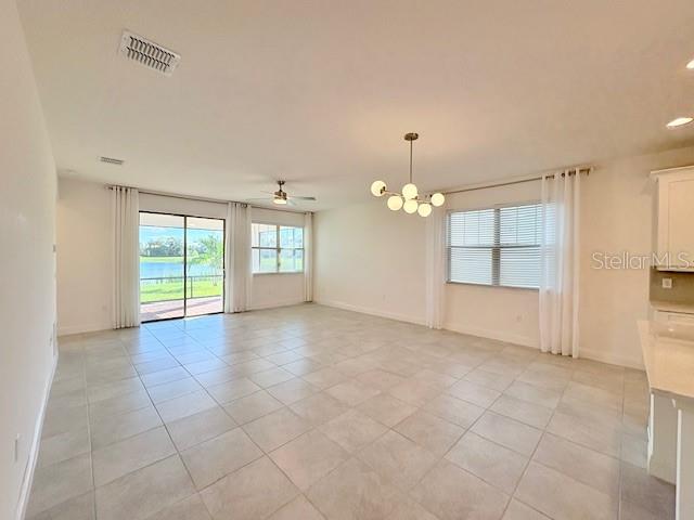 7408 Wing Span Way Harmony, FL 34773 - Photo 6 of 30 a view of an empty room with a window