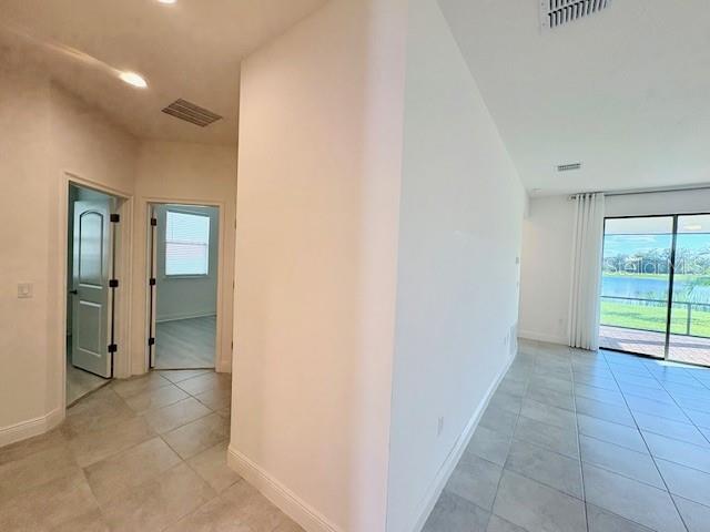 7408 Wing Span Way Harmony, FL 34773 - Photo 8 of 30 a view of an empty room with window and bathroom
