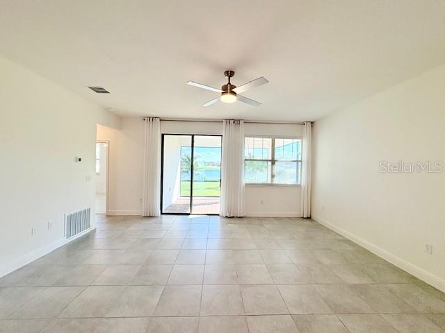 7408 Wing Span Way Harmony, FL 34773 - Photo 9 of 30 a view of an empty room with a window