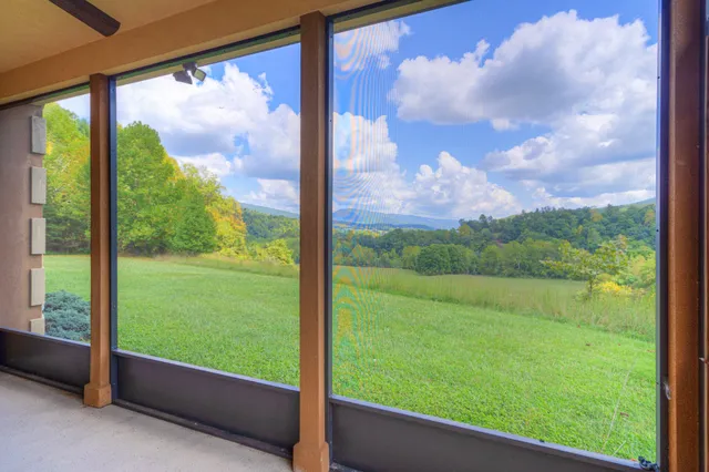 a living room with hardwood and windows