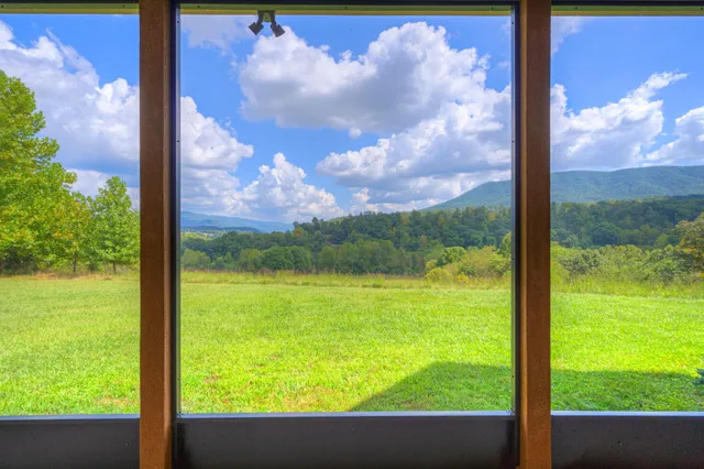 an empty room with a empty space and windows