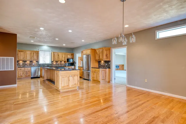 a bathroom with a shower a mirror and a sink