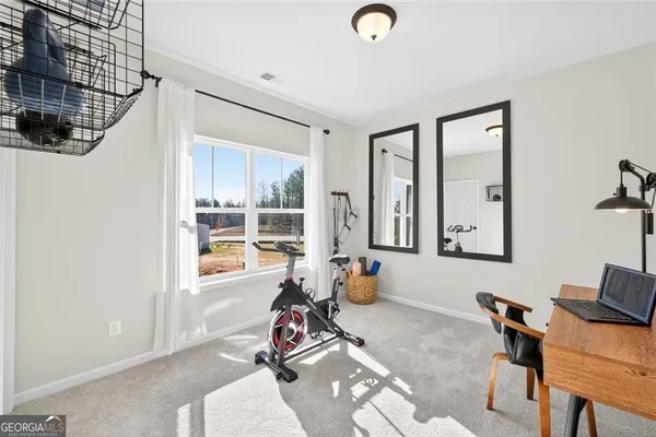 a view of a house with snow on the road
