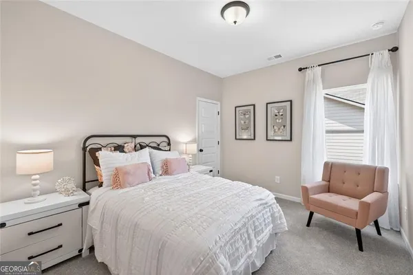 a bathroom with double sink and a mirror