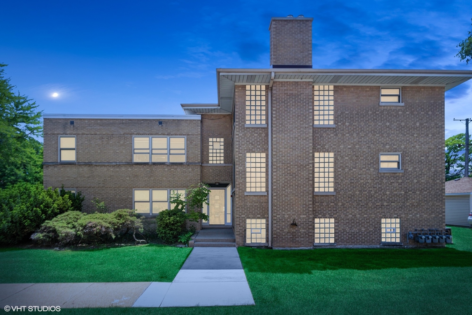 3024 Harlem Avenue Riverside, IL 60546 - Photo 12 of 12 a brick building with a yard in front of it