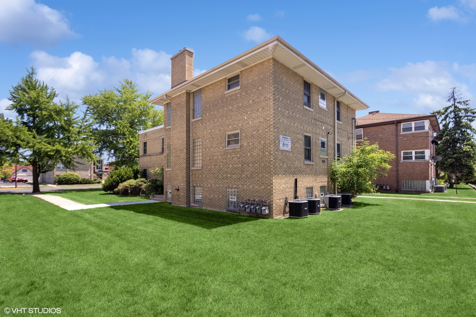 3024 Harlem Avenue Riverside, IL 60546 - Photo 2 of 12 a front view of house with yard and green space