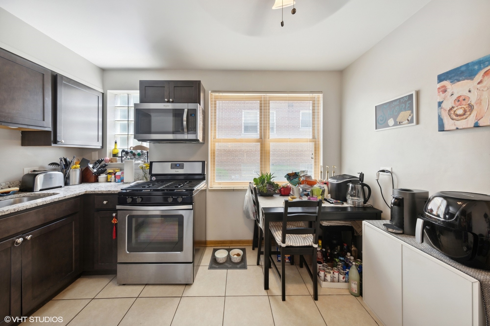 3024 Harlem Avenue Riverside, IL 60546 - Photo 6 of 12 a kitchen with a stove sink and cabinets