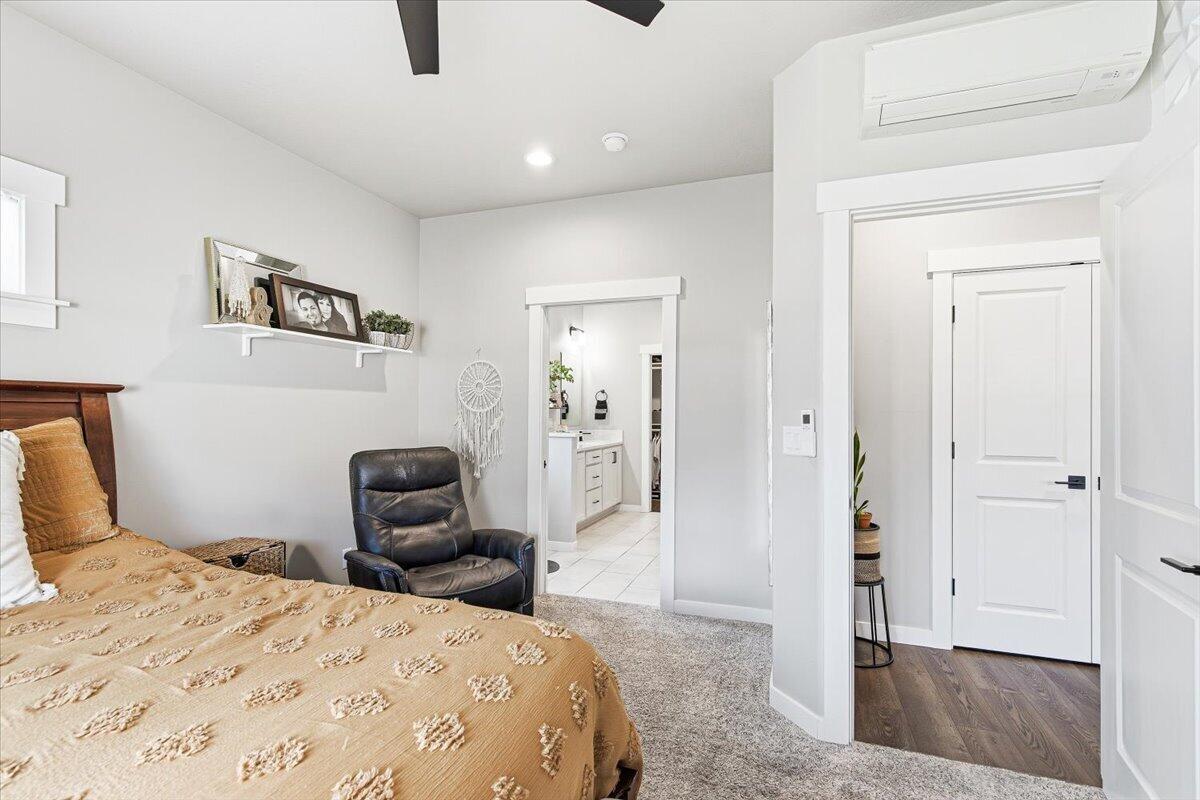 248 Christopher Way Talent, OR 97540 - Photo 14 of 33 a bedroom with a bed and wooden floor