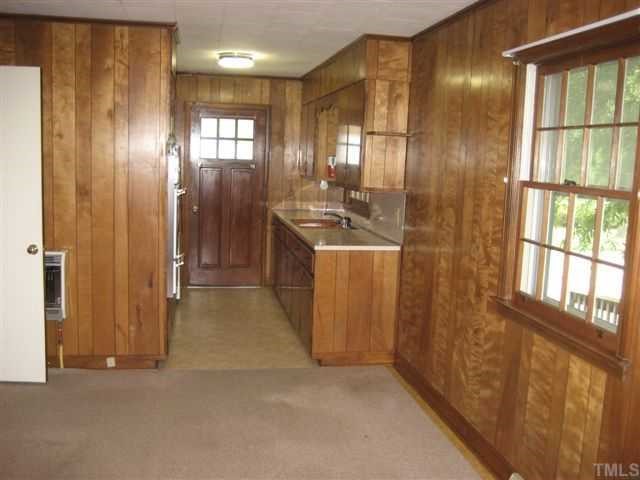 309 Pine Tree Road Oxford, NC 27565 - Photo 4 of 6 Galley Kitchen with Dining Area