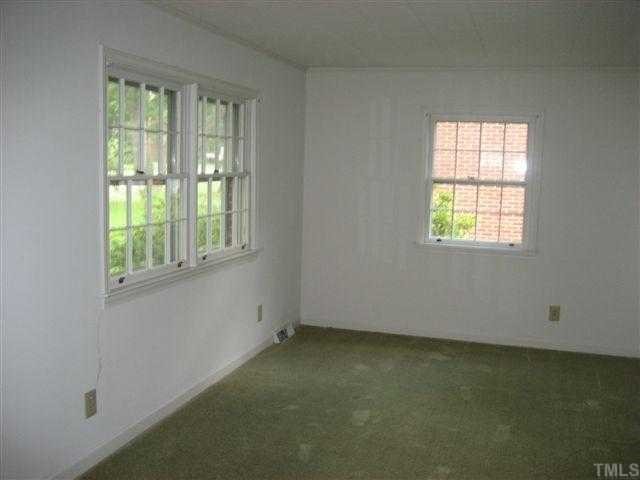 309 Pine Tree Road Oxford, NC 27565 - Photo 5 of 6 Living Room with carpet over hardwood floors