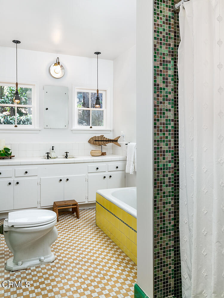 1317 Gates Place South Pasadena, CA 91030 - Photo 28 of 49 a bathroom with a sink toilet a mirror and shower