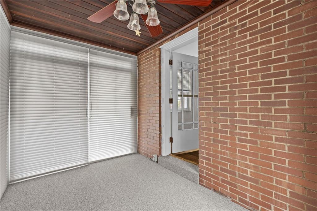 630 Kelso Road Pittsburgh, PA 15243 - Photo 15 of 33 a view of a livingroom with a brick wall and a window