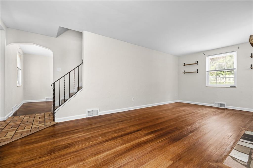 630 Kelso Road Pittsburgh, PA 15243 - Photo 6 of 33 a view of an empty room with wooden floor and a window