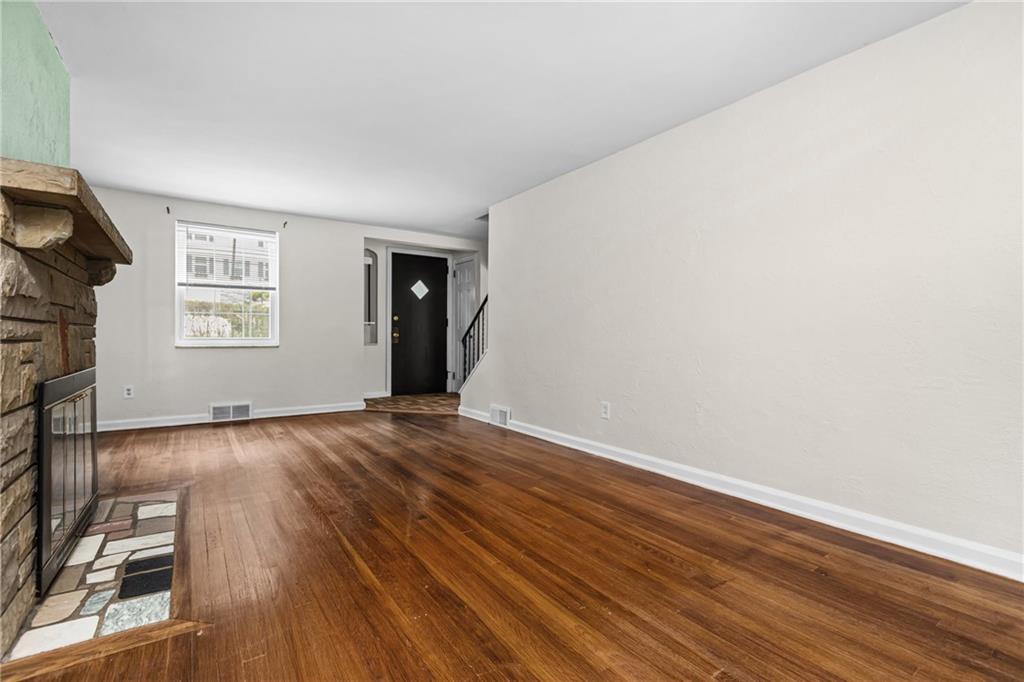 630 Kelso Road Pittsburgh, PA 15243 - Photo 7 of 33 an empty room with wooden floor and windows