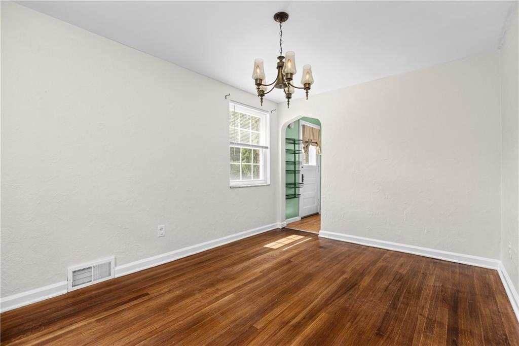 630 Kelso Road Pittsburgh, PA 15243 - Photo 8 of 33 a view of a room with wooden floor chandelier and a window