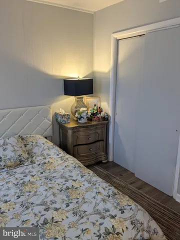 a bed in a room with a dresser