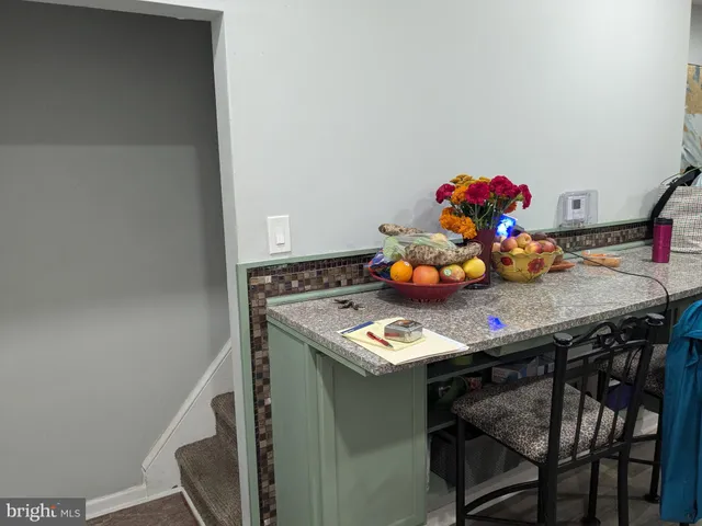 a table with chairs and white table top
