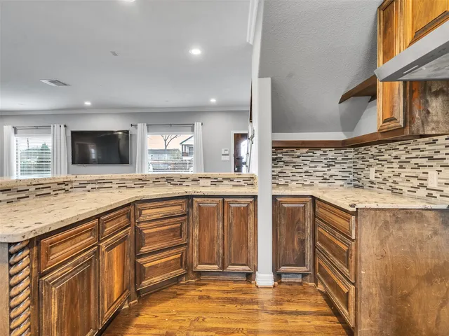 a bathroom with a toilet a sink and shower