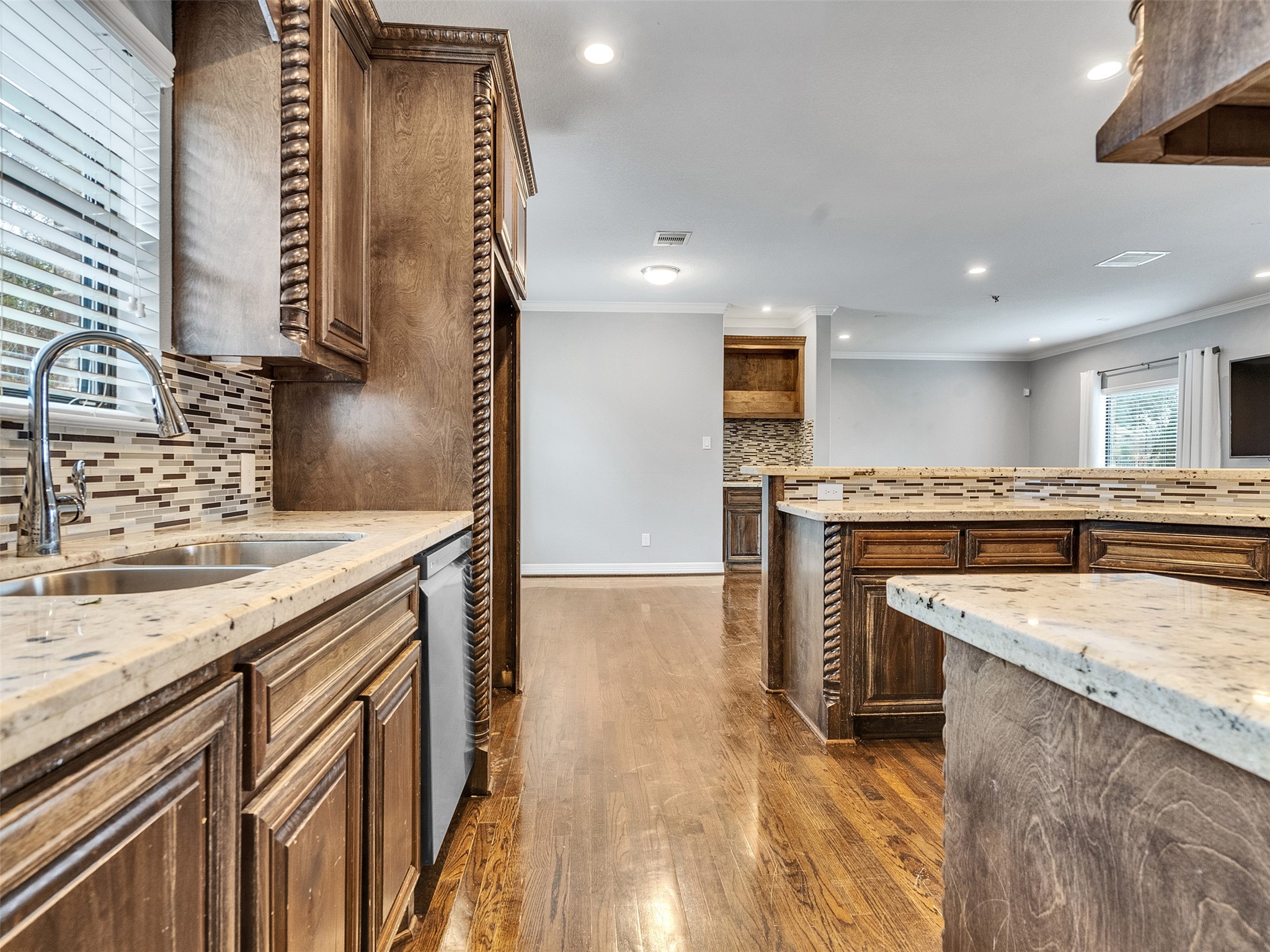 5814 Luna Street Houston, TX 77076 - Photo 16 of 44 a kitchen with a sink stove and cabinets