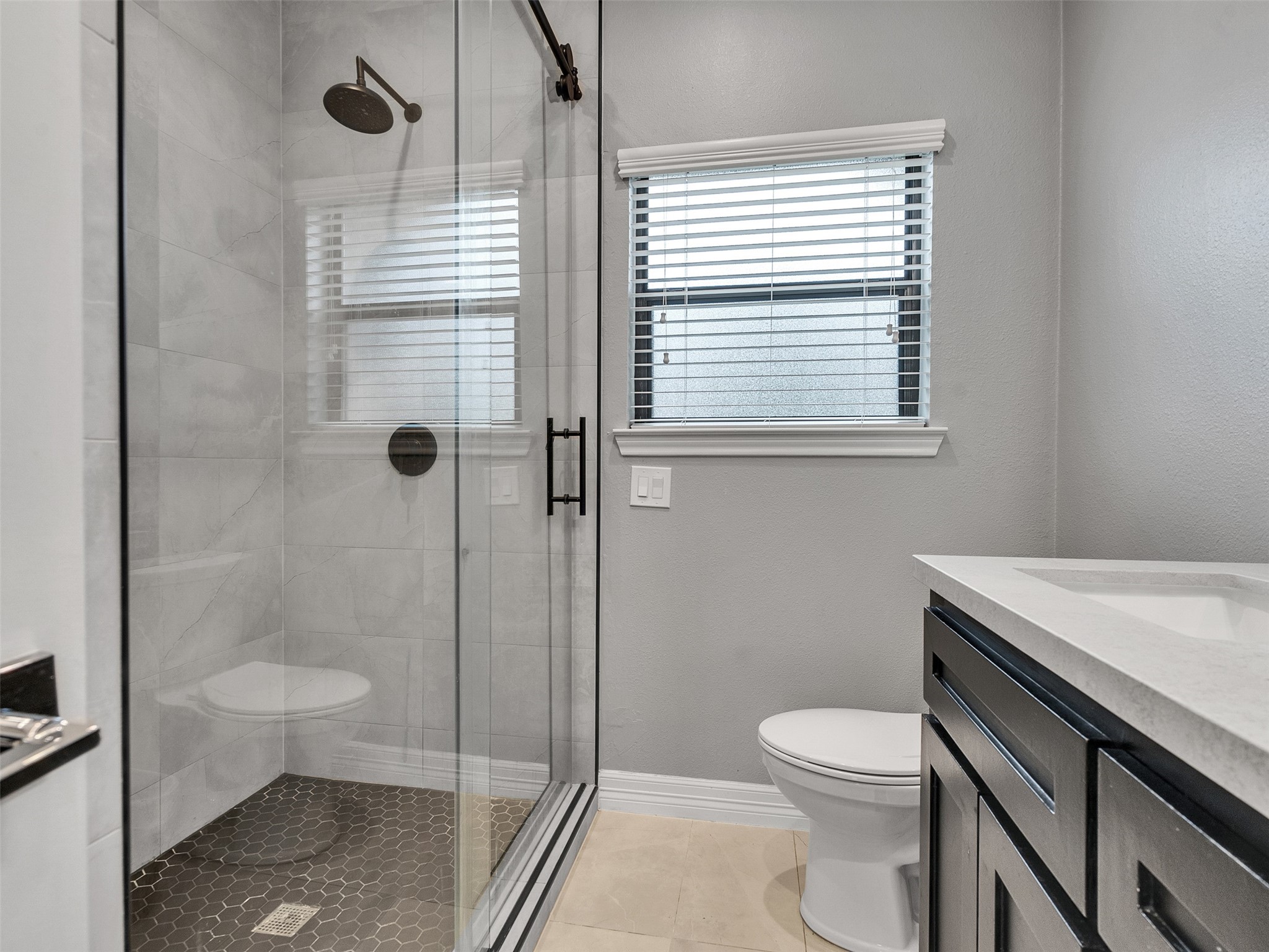 5814 Luna Street Houston, TX 77076 - Photo 20 of 44 a bathroom with a toilet a sink and shower