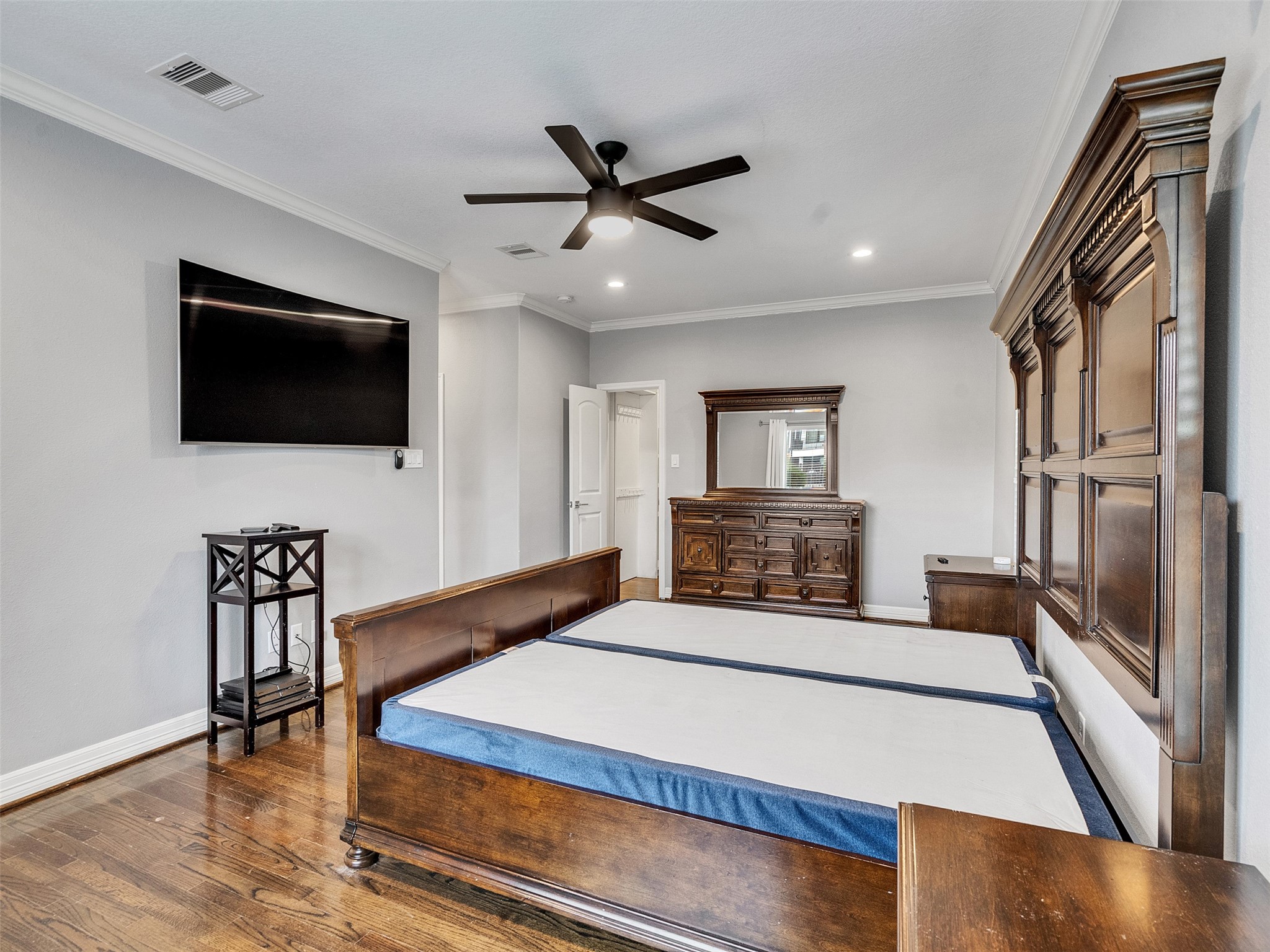 5814 Luna Street Houston, TX 77076 - Photo 23 of 44 a bedroom with a bed and a flat screen tv