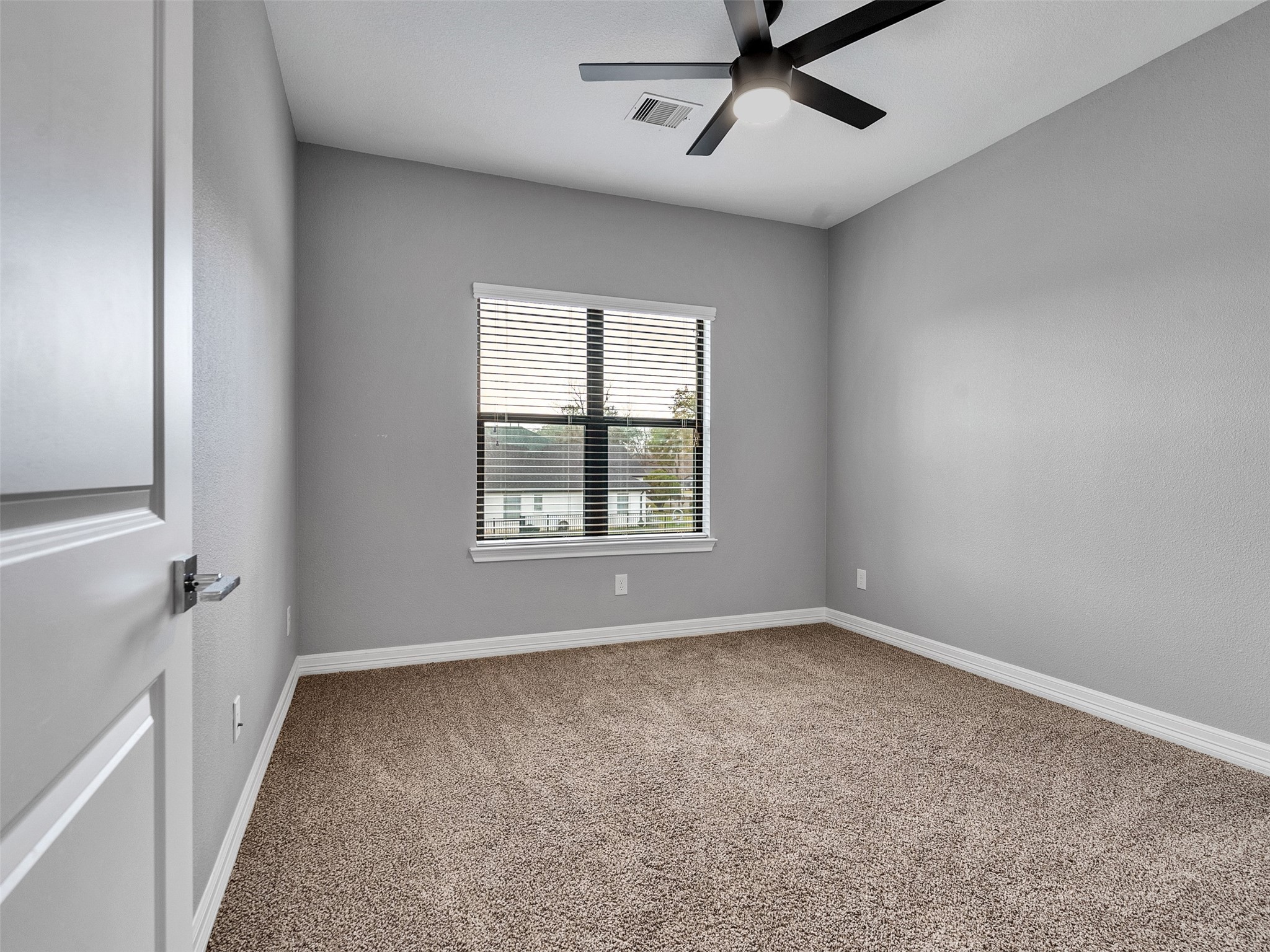 5814 Luna Street Houston, TX 77076 - Photo 25 of 44 a view of an empty room with a window