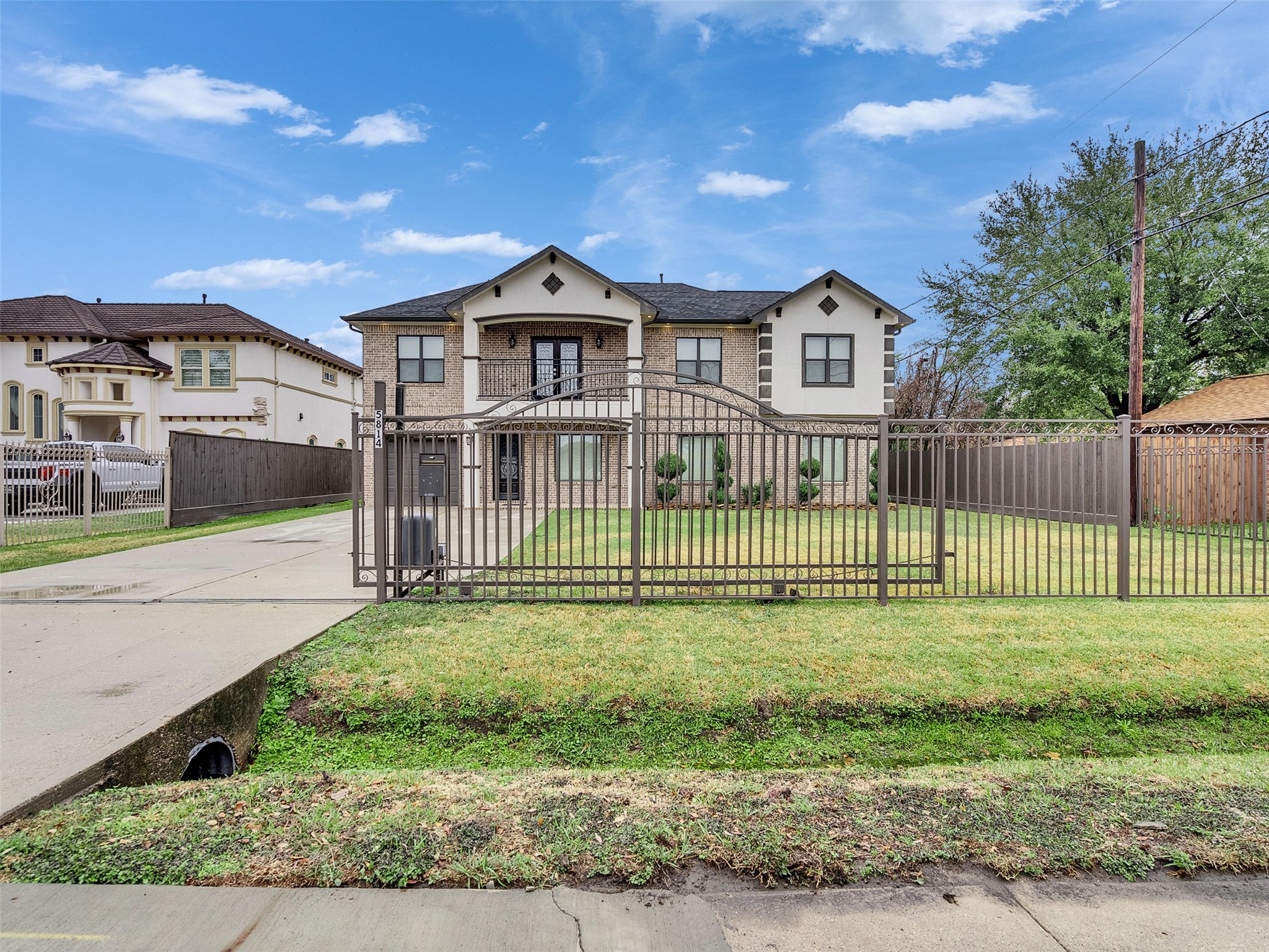 5814 Luna Street Houston, TX 77076 - Photo 3 of 44 a front view of a house with a yard