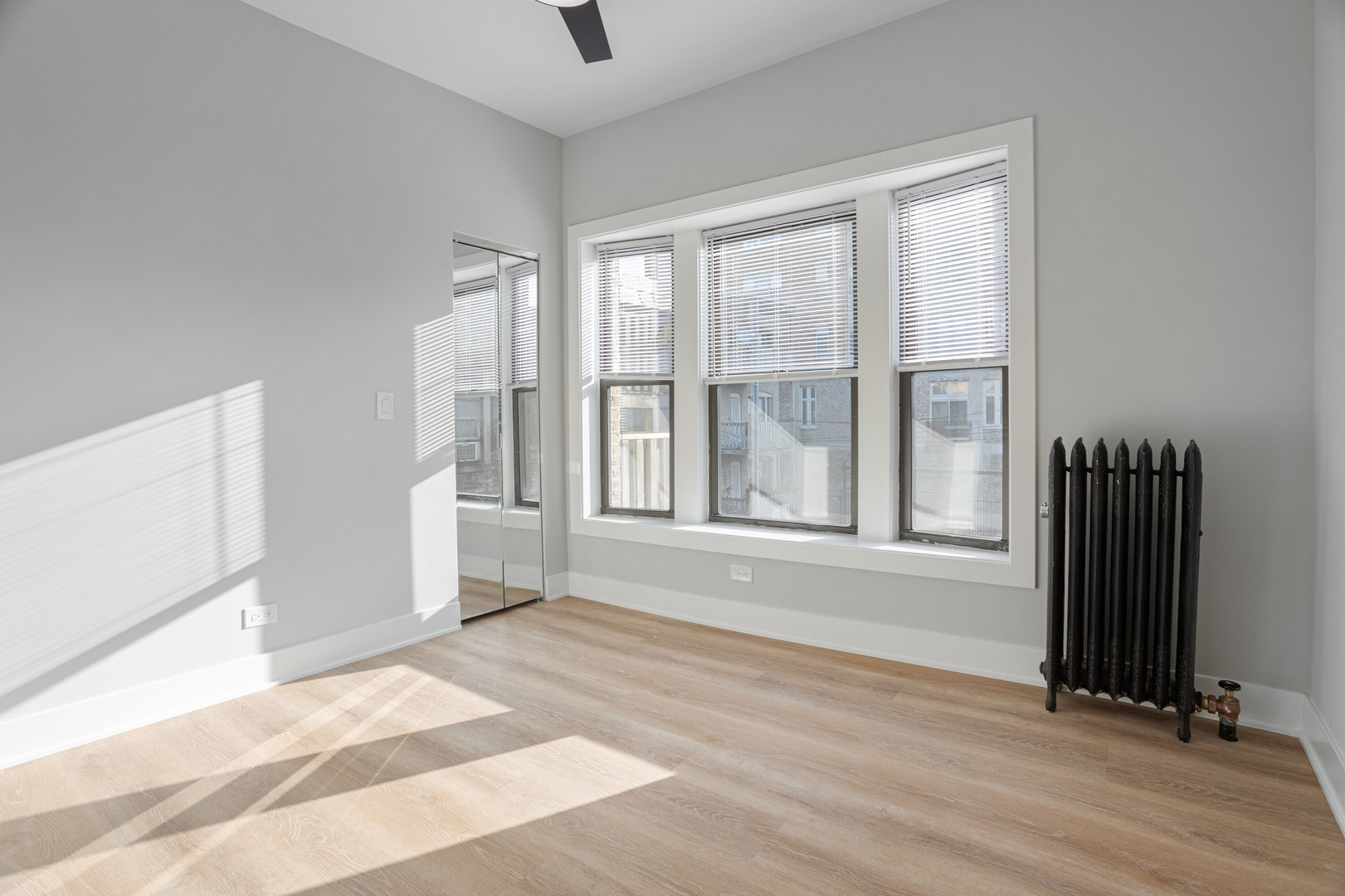 6929 North Lakewood Avenue, Unit 2 Chicago, IL 60626 - Photo 9 of 13 a view of an empty room with a window and a kitchen view