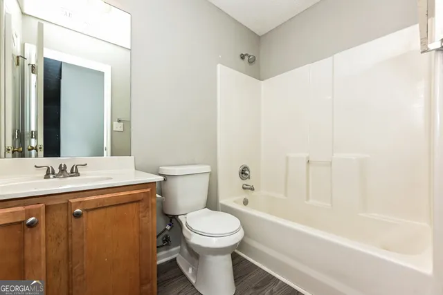 a bathroom with a toilet a sink and a bathtub