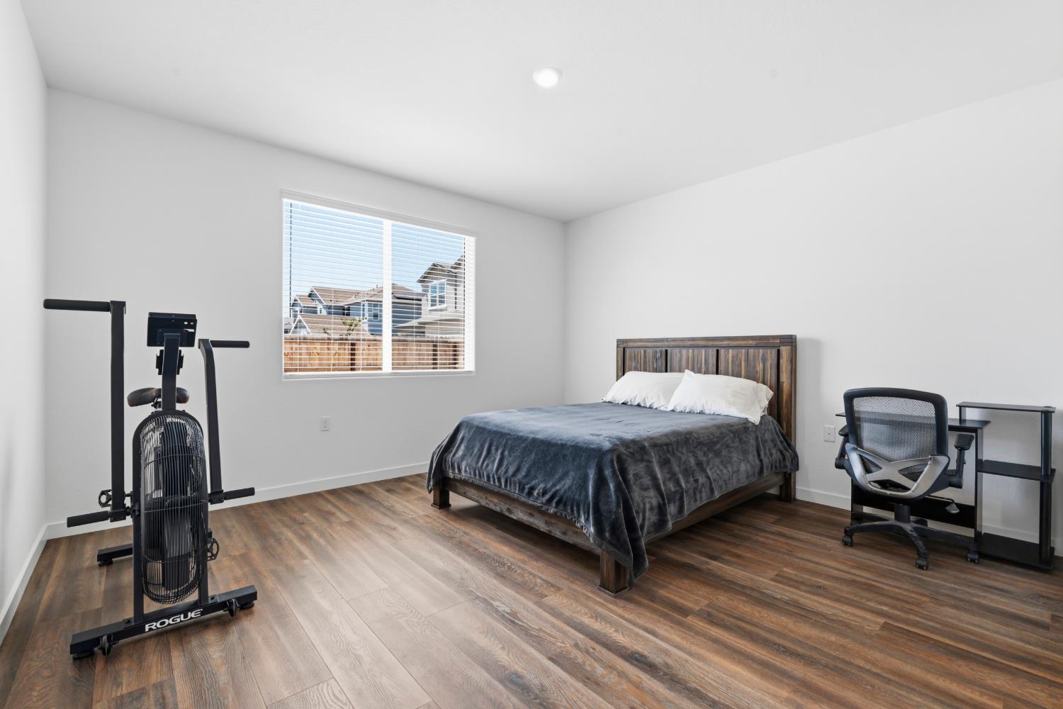 5713 Natalie Way Keyes, CA 95328 - Photo 9 of 30 a bedroom with a bed and a window