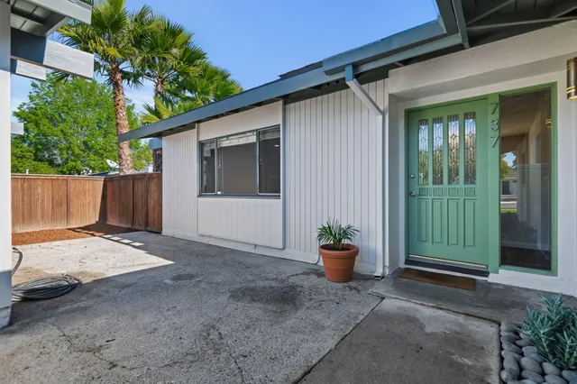 a backyard of a house with seating space