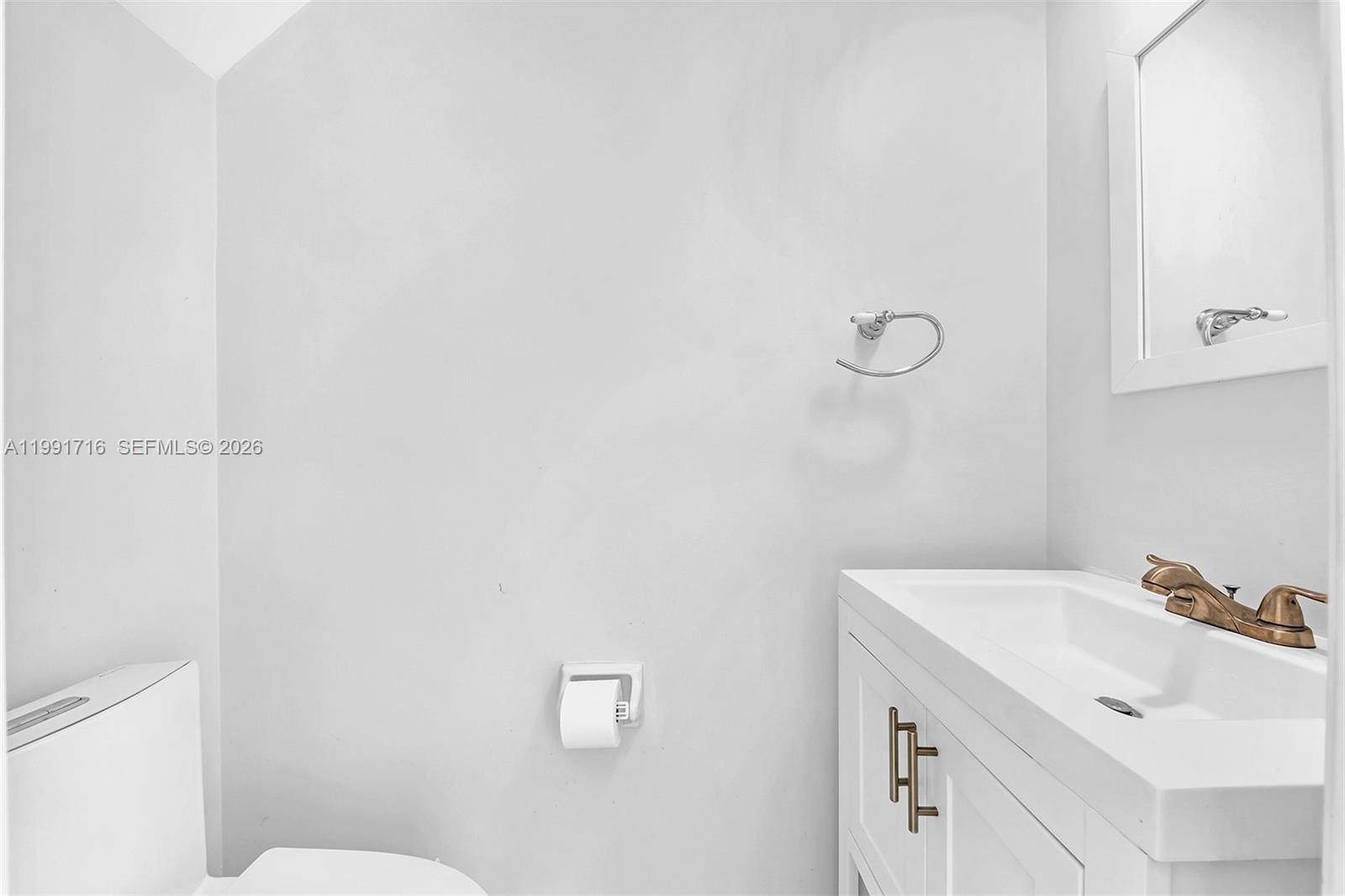 3085 North 36th Avenue Hollywood, FL 33021 - Photo 12 of 76 a bathroom with a sink and a toilet