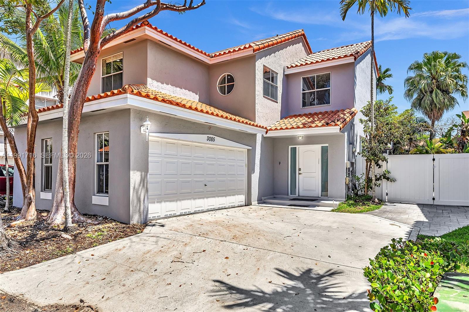 3085 North 36th Avenue Hollywood, FL 33021 - Photo 2 of 76 a front view of a house with a yard