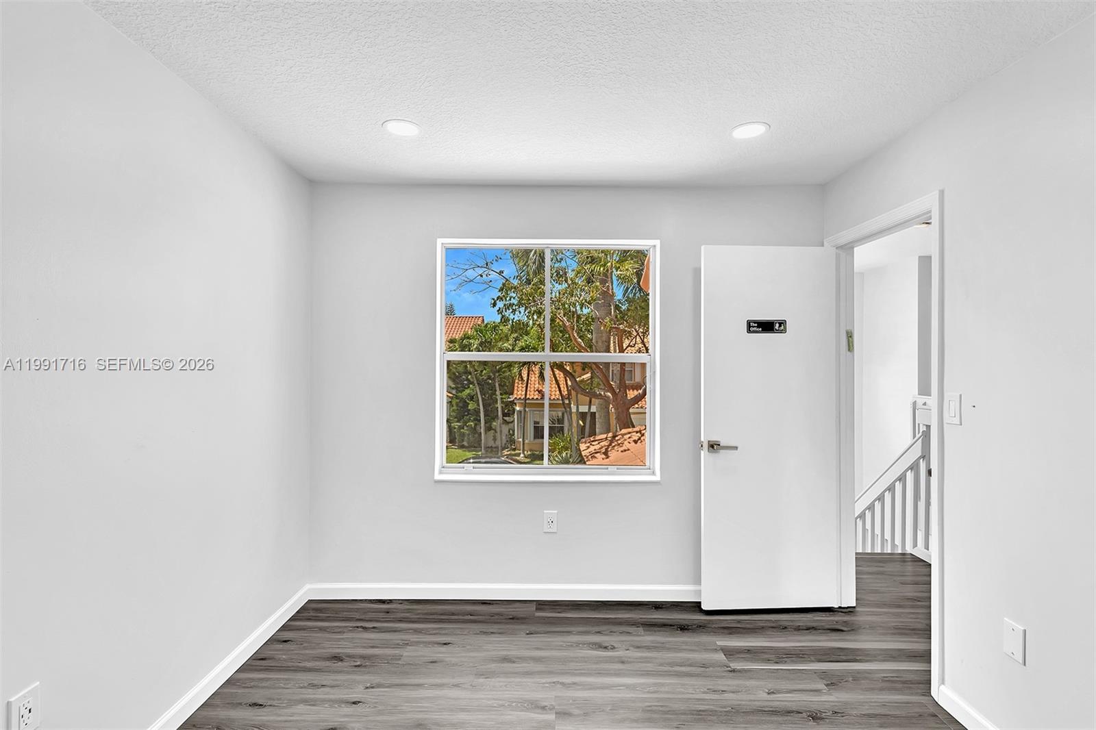 3085 North 36th Avenue Hollywood, FL 33021 - Photo 32 of 76 an empty room with wooden floor and windows