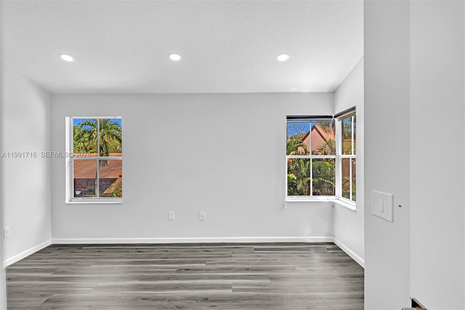3085 North 36th Avenue Hollywood, FL 33021 - Photo 38 of 76 an empty room with wooden floor and windows