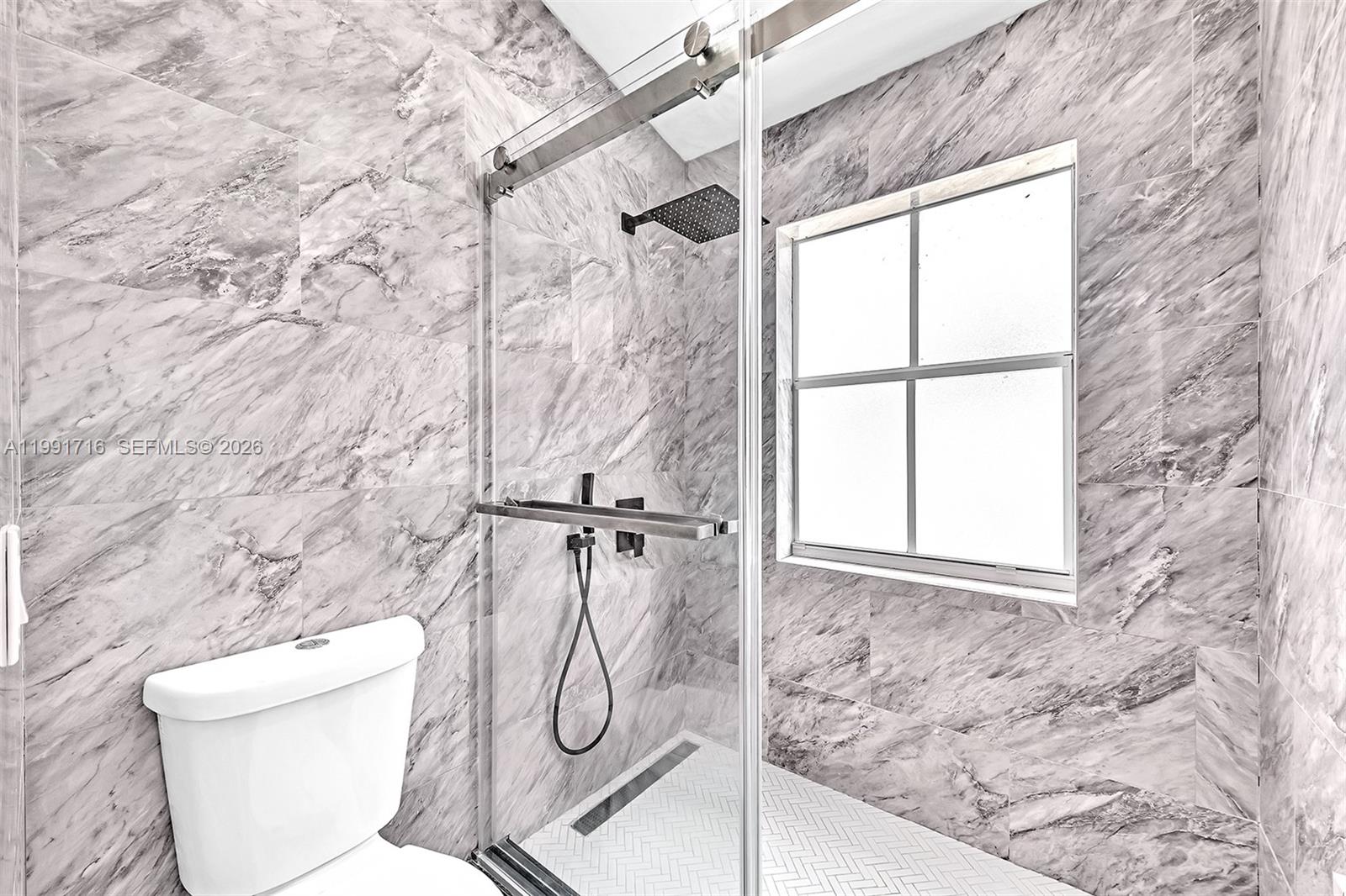 3085 North 36th Avenue Hollywood, FL 33021 - Photo 46 of 76 a bathroom with a toilet and a shower